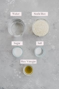 ingredients to make rice in small bowls on a gray surface with white writing below them