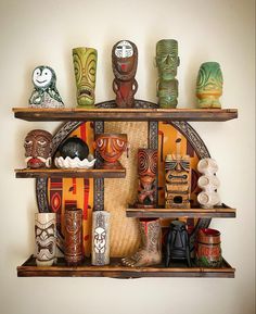 a shelf filled with lots of different types of vases on top of wooden shelves