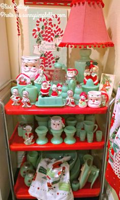 a red shelf filled with lots of christmas items