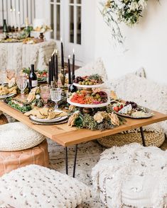 the table is set with food and candles