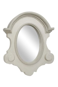 a white mirror with an ornate design on the front and back side, against a white background