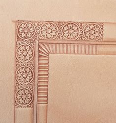 a drawing of a decorative frame on a wall