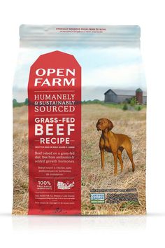 an open farm dog food bag with a brown dog standing in the middle of it