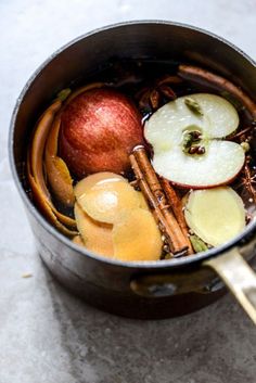 an apple cider is filled with apples, cinnamons and other ingredients in it