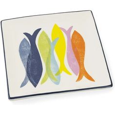 four colorful fish on a white plate