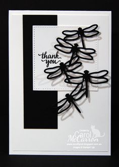 a black and white card with dragonflys on it's side, saying thank you