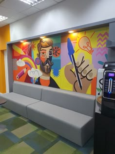 an office waiting area with colorful paintings on the wall