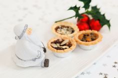 three miniature christmas pies on a white plate