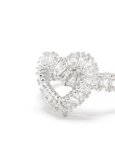 an open heart shaped diamond ring on a white background