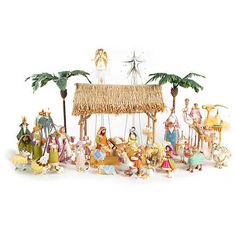 a nativity scene with figurines and palm trees