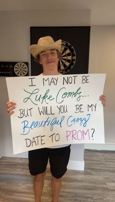 a man holding a sign that says i may not be luke comes but will you be my beautiful candy date to prom?