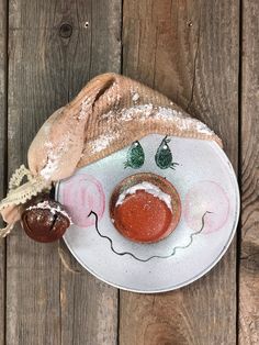 a plate with some food on it and a baguette in the shape of a face