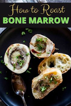 a black plate topped with bread covered in sauce and herbs next to a spoon on top of it