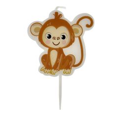 a cake topper with a monkey on it