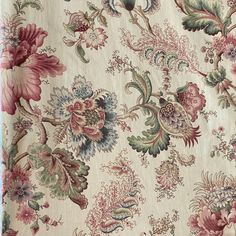 an old wallpaper with flowers and vines on it's side, as well as other floral designs