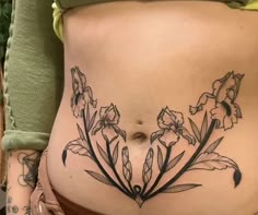 a woman's stomach with flowers drawn on it