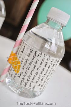 a bottle of water with a straw sticking out of it