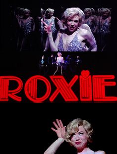 a woman is waving in front of a large screen with the words roxlie on it