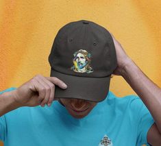 A classic Dad Cap featuring a profile of Jesus Christ embroidered on the front. This cap provides a comfortable fit for everyday wear, making it a great accessory for those who want to showcase their faith in a subtle way. Perfect for Christians celebrating Easter, Christmas, and other religious holidays. Product features - Comfortable fit for everyday wear - 6-panel structure with eyelets on each panel - Precurved visor with 4 rows of stitches - Adjustable snap closure for the perfect fit - 100% cotton construction Care instructions - Use warm water and dish soap and clean spots off your hat. It's not necessary to soak the whole item. For hard to clean spots use a soft bristled brush. Jesus Christus, Dad Cap, Dad Caps, Religious Gifts, Dad Hat, Baseball Hat, Trucker Cap, Gift For Him, Dad Hats