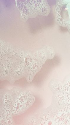 soap bubbles in a bathtub with pink and blue colors