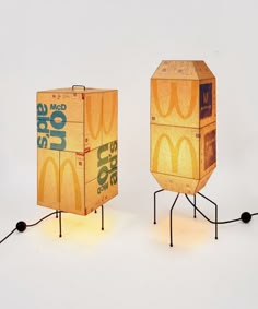 two cardboard boxes sitting on top of each other in the shape of mcdonald's