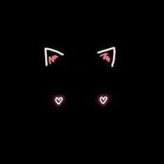 an image of two eyes in the dark with hearts on their ears and one eye closed