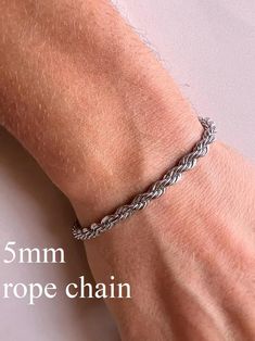 Stainless Steel Rope Chain in Silver Tone. Elevate your style with our men's silver-tone stainless steel chain bracelet. Crafted from durable stainless steel, this bracelet is resistant to corrosion and tarnish, ensuring long-lasting shine and reliability. Features: - Material: Stainless Steel - Color: Silver-Tone - Sizes: Available in various lengths for a perfect fit You can see our other bracelet designs here https://www.etsy.com/shop/TheUrbanMonarch?ref=l2-about-shopname&from_page=listing§ion_id=49985390 This bracelet is perfect for both everyday wear and special occasions, easily pairing with other accessories and jewelry. The secure clasp ensures comfort and safety. Add a touch of elegance and modern flair to your wardrobe with this versatile chain bracelet! How to Choose the Right S Men's Bracelet, Stainless Steel Jewelry, Rope Chain, Silver Man, Steel Chain, Chain Link Bracelet, Stainless Steel Chain, Bracelet Designs, Stainless Steel Bracelet