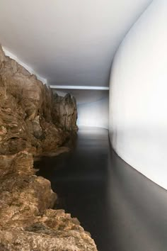 a long narrow hallway between two large rocks