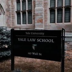 a sign in front of a building that says vale law school