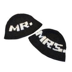 two knitted hats with the word mr and mrs written on them, both black and white