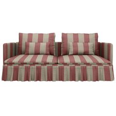 a red and white striped couch with two pillows on top of the backrests