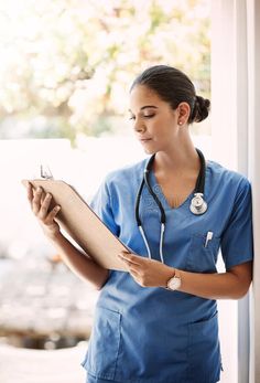 Checking your records. an attractive young female medical practitioner holding a clipboard in a hospital. stock images Hospital Advertisement, Holding Clipboard, Clipboard, Hold On, Medical