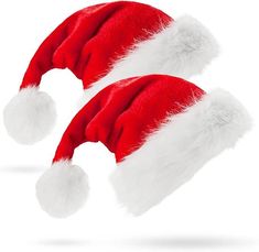 two red and white santa claus hats on top of each other