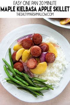 a white plate topped with meat and veggies on top of mashed potatoes