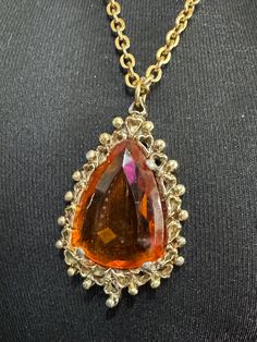 Vintage gold tone orange 5cm amber faceted Glass teardrop pendant necklace on 70cm chain Elegant Glass Drop Jewelry, Elegant Drop Glass Jewelry, Elegant Drop-shaped Glass Jewelry, Teardrop Party Necklace With Chain, Orange Gemstone Pendant Jewelry, Teardrop Glass Beads For Jewelry Making, Orange Gemstone Dangle Jewelry, Orange Gemstone Jewelry For Formal Occasions, Formal Teardrop Chain Necklace With Adjustable Chain