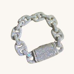 Introducing our stunning Silver Icy Bold Link Diamond Bracelet, the epitome of elegance and luxury. Crafted to make a bold statement, this exquisite piece features high-quality simulated diamonds set in icy silver, radiating brilliance and sophistication. Elevate any ensemble with this dazzling bracelet, perfect for those who appreciate fine craftsmanship and undeniable beauty. Make a lasting impression with this striking accessory that effortlessly exudes glamour and style. ✔Hypoallergenic ✔Quality Guaranteed COLOR: silver LENGTH: 7 inches MATERIAL: rhodium plated, simulated diamonds Luxury Silver Diamond Bracelet With Complimentary Chain, Party Diamond White Bracelet With Diamond Accents, Party Diamond Bracelet With Diamond Accents, Formal Iced Out Diamond White Bracelet, Luxury Diamond White Bracelet With Bling, Party Diamond Bracelet In White Gold, Dazzling White Gold Diamond Bracelet For Party, Party Bracelets With Diamond Accents, Iced Out Crystal Jewelry For Formal Occasions