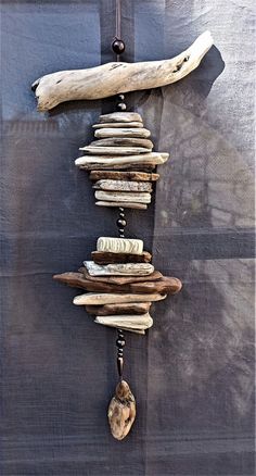 driftwood and beads hanging on a wall