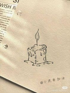 a piece of paper with a drawing of a candle on it and the words wish written in chinese