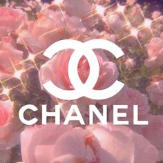 the chanel logo is surrounded by pink flowers