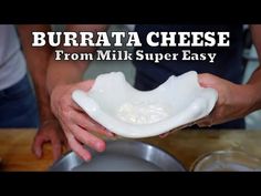 a person holding a bowl with cheese in it and the words burrata cheese from milk super easy