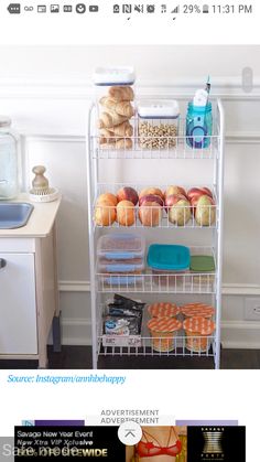 a white metal shelf filled with lots of food