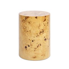 a gold colored wooden stool with speckles on it