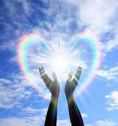 two hands reaching up into the sky with a rainbow in the middle and text that reads, may all beings experience a life of love and blessing sending love and