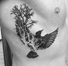 a black and white photo of a man's chest with a bird on it