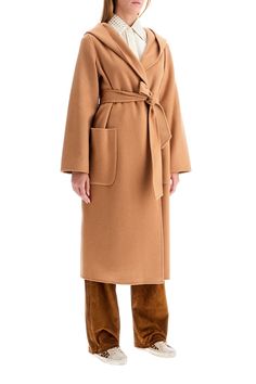 Long coat by Ivy Oak hand stitched in soft RWS-certified wool, with wrap design cinched at the waist with matching self-tie belt. It features built-in hood, patch pockets and back-center vent. Straight deconstructed cut unlined on the inside. The model is 177 cm tall and wears size DE 34. Composition: 100% WO Medium Coat, Ivy Oak, Pleats Please Issey Miyake, Hooded Coat, Outerwear Coats, Chic Dress, Blouse Dress, Tie Belt, Long Coat