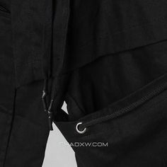 the back view of a man's pants with zippers and buttons on it