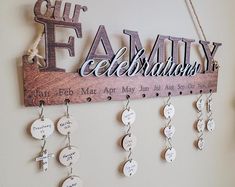 a wooden sign hanging on the wall with many different names and numbers attached to it