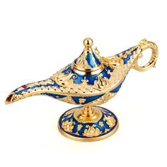 an ornate blue and gold teapot on a stand