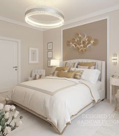 a large white bed sitting in a bedroom next to a table with flowers on it