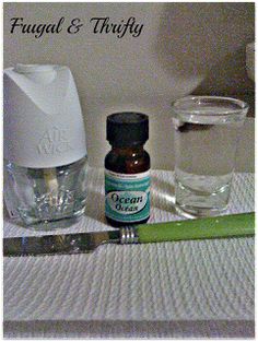 an assortment of essentials on a table with water and a green handled utensil